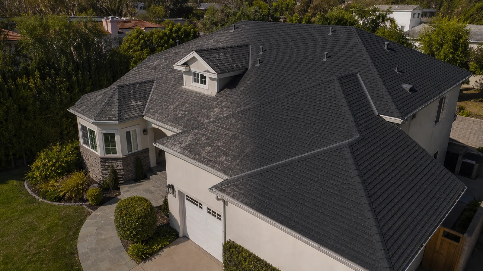Weathered and new architectural shingles compared on the same Los Angeles home