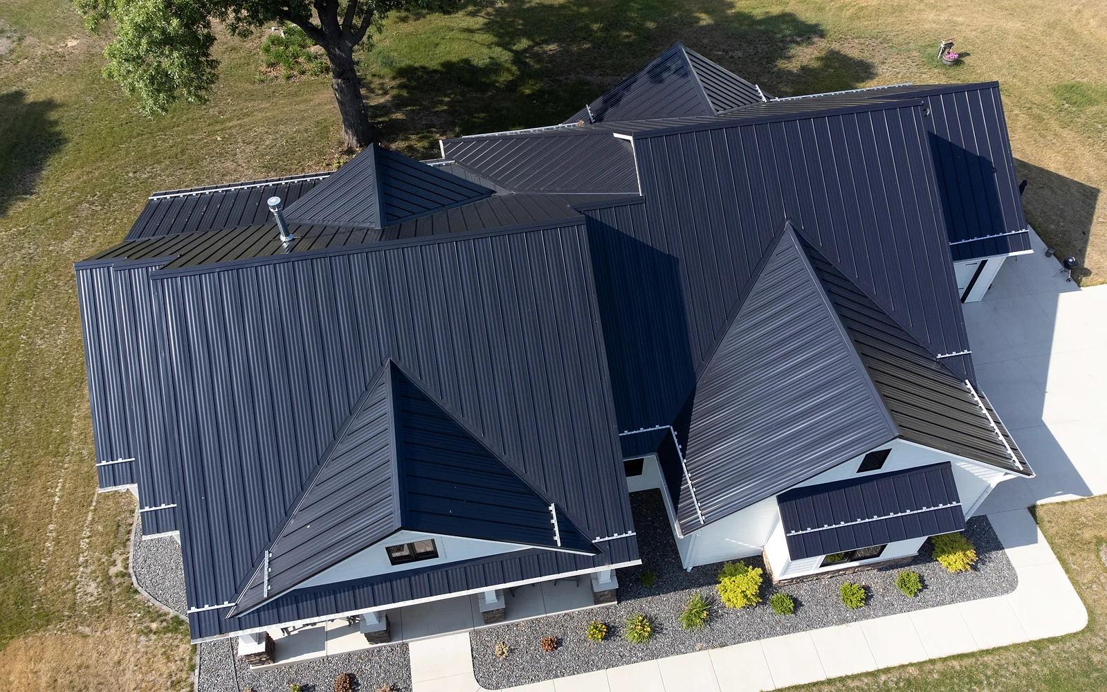Real charcoal standing-seam metal roof photographed from above