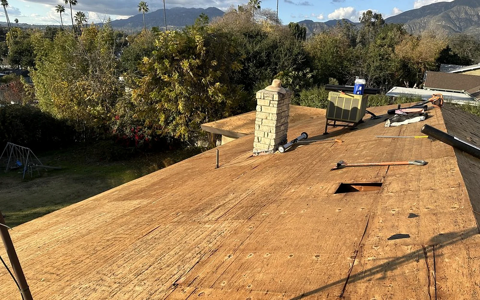 Plywood deck preparation during a documented Sky Shield Roofing tear-off project
